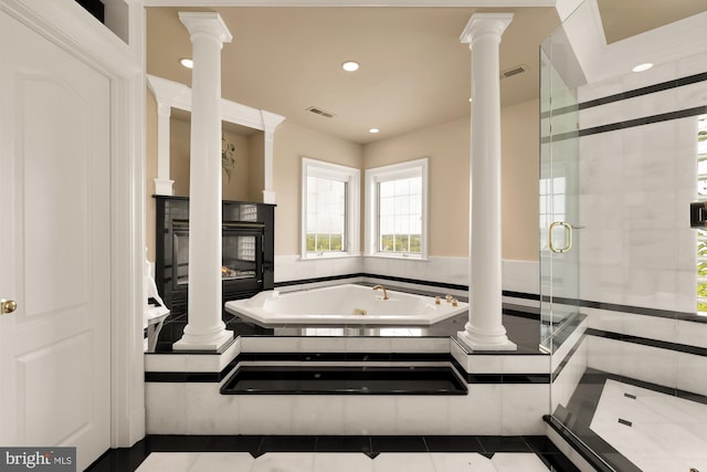 bathroom with tile patterned flooring and independent shower and bath