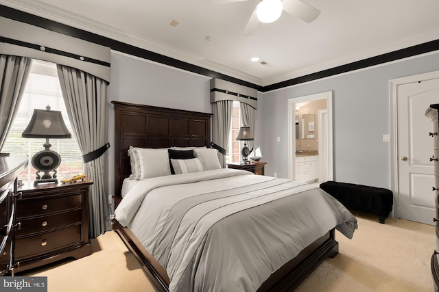 bedroom featuring light carpet, connected bathroom, multiple windows, and ceiling fan