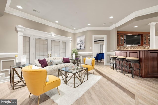14950 Kelley Farm, Darnestown, MD 20874 - living area featuring decorative columns, light wood-type flooring, recessed lighting, ornamental molding, and a wainscoted wall
