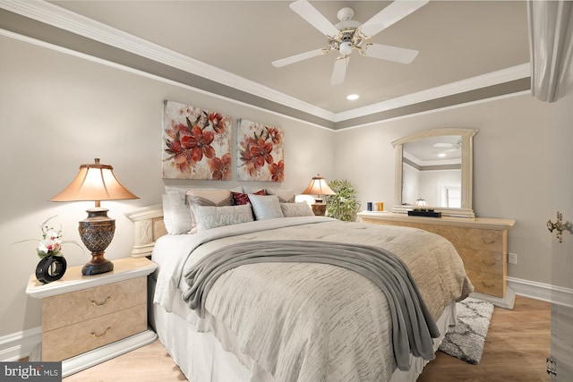 bedroom with ceiling fan, crown molding, and light parquet flooring