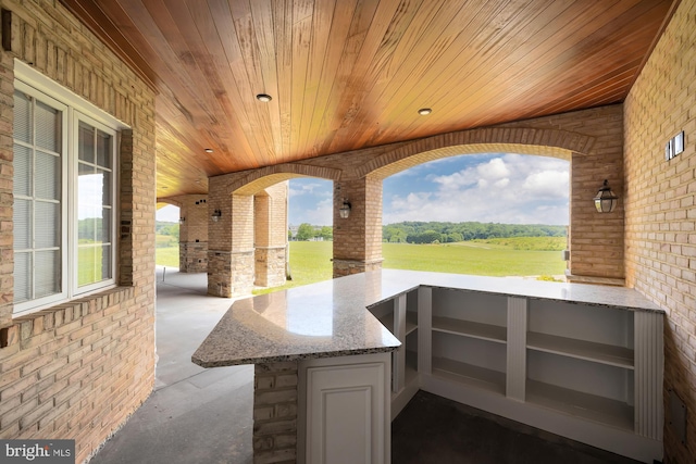 view of patio / terrace featuring a rural view and an outdoor bar