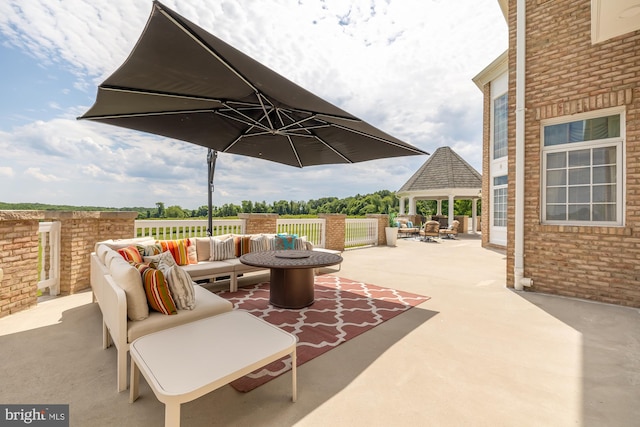 view of patio featuring a gazebo and an outdoor living space