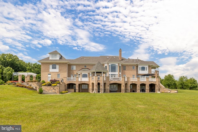 14950 Kelley Farm, Darnestown, MD 20874 - rear view of house with a balcony, a lawn, stone siding, and brick siding