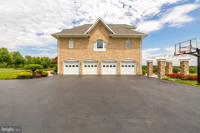 14950 Kelley Farm, Darnestown, MD 20874 - view of side of home with an attached garage, asphalt driveway, a shingled roof, and brick siding