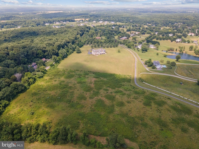 drone / aerial view with a water view and a rural view