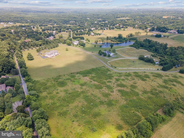 aerial view featuring a rural view and a water view