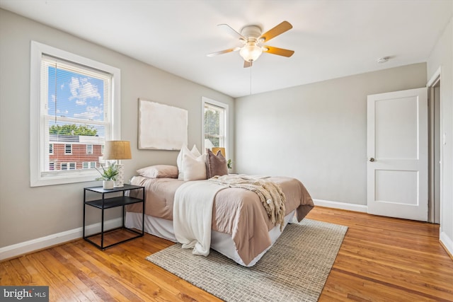 bedroom featuring ceiling fan and light hardwood / wood-style floors