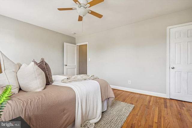 bedroom featuring light hardwood / wood-style flooring and ceiling fan