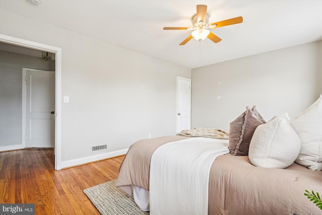 bedroom featuring hardwood / wood-style flooring and ceiling fan