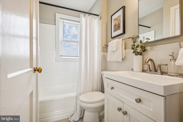 full bathroom featuring vanity, backsplash, toilet, and tile walls