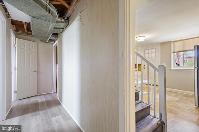 hallway with wood-type flooring