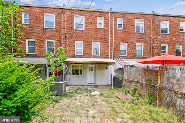 back of property featuring cooling unit