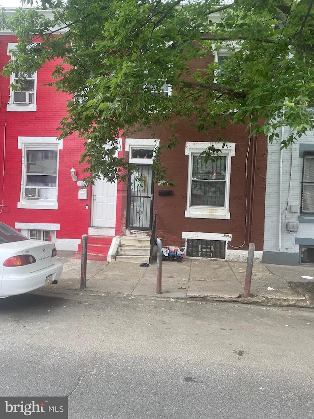 view of front of property featuring cooling unit