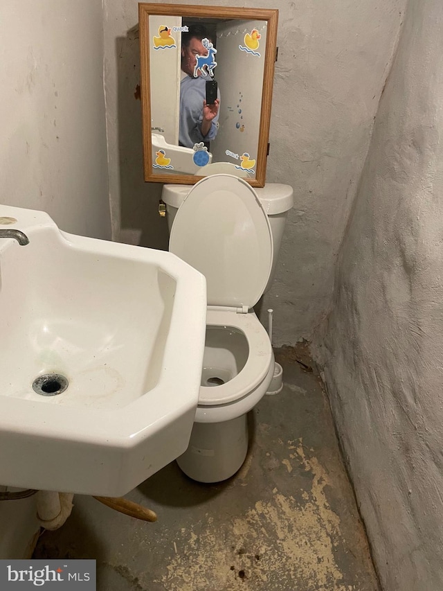 bathroom with toilet and sink