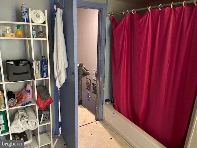 bathroom featuring shower / tub combo with curtain