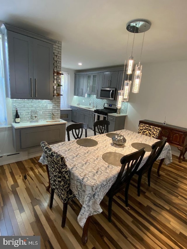 dining room featuring recessed lighting and wood finished floors