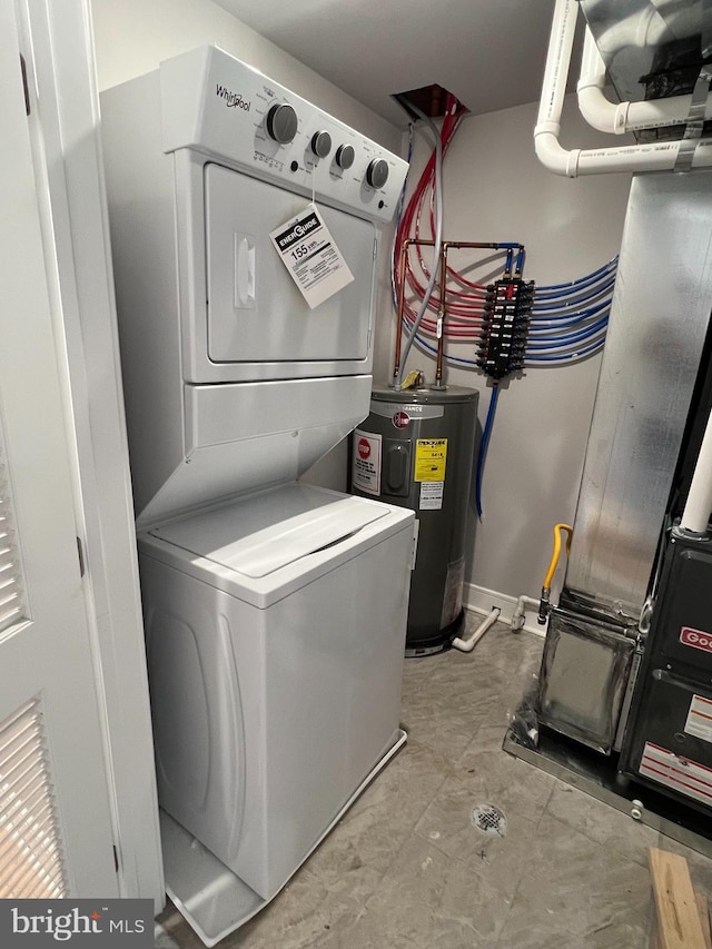 washroom featuring heating unit, stacked washer / drying machine, and water heater