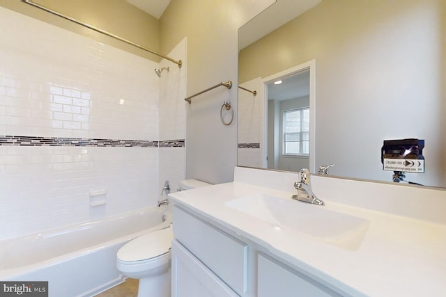 full bathroom featuring vanity, toilet, and tiled shower / bath combo