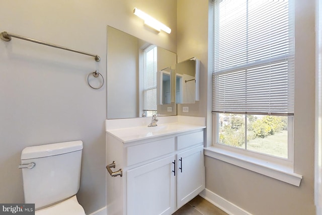 bathroom with tile patterned floors, vanity, and toilet