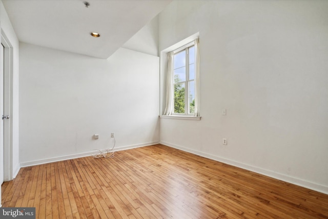 empty room featuring hardwood / wood-style flooring