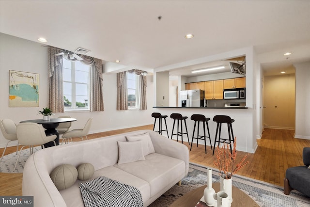 living room featuring light wood-type flooring