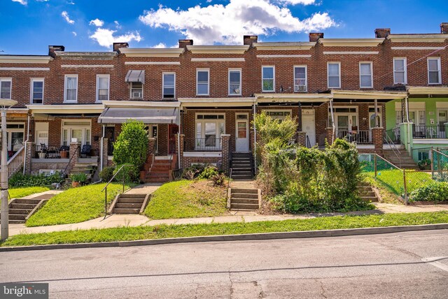 townhome / multi-family property with covered porch