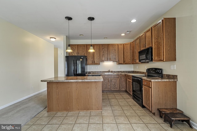 kitchen with a center island, light carpet, black appliances, sink, and hanging light fixtures