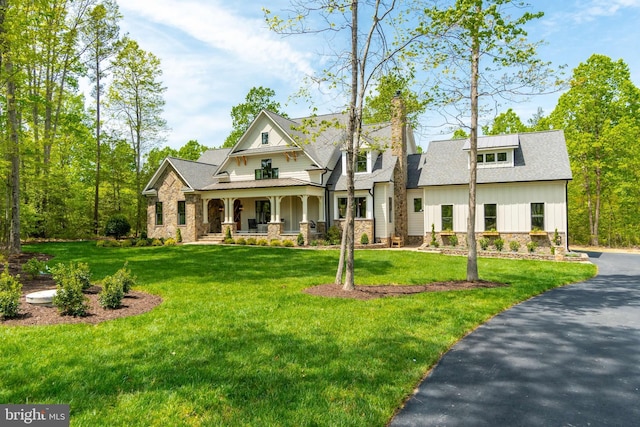 view of front of home featuring a porch and a front yard