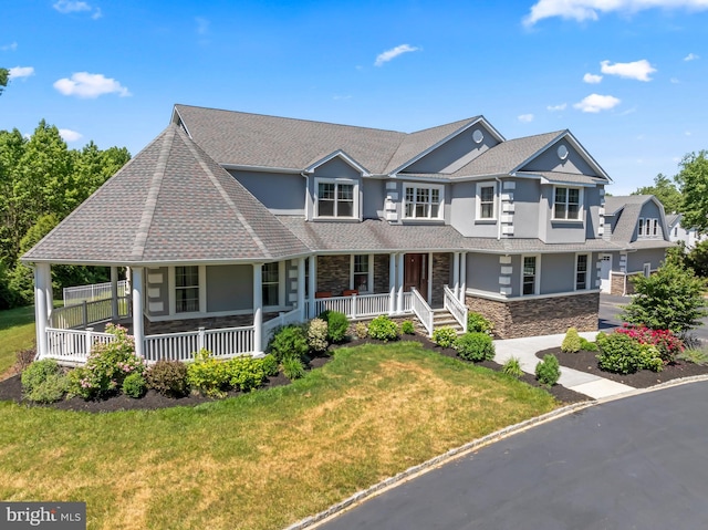 view of front of home featuring a porch and a front lawn