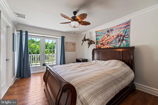 bedroom with access to exterior, dark hardwood / wood-style floors, ceiling fan, and crown molding