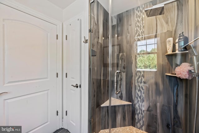 bathroom with a shower with shower door