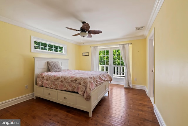 bedroom featuring dark hardwood / wood-style flooring, access to outside, and ornamental molding