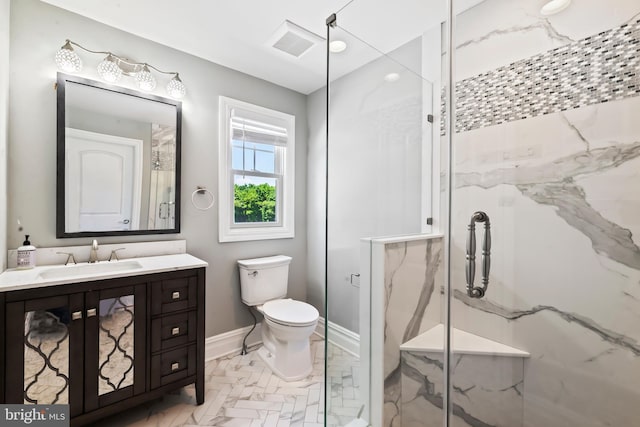 bathroom with toilet, an enclosed shower, and vanity