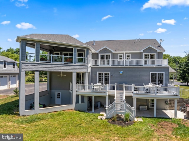 back of house with ceiling fan, a patio area, and a balcony