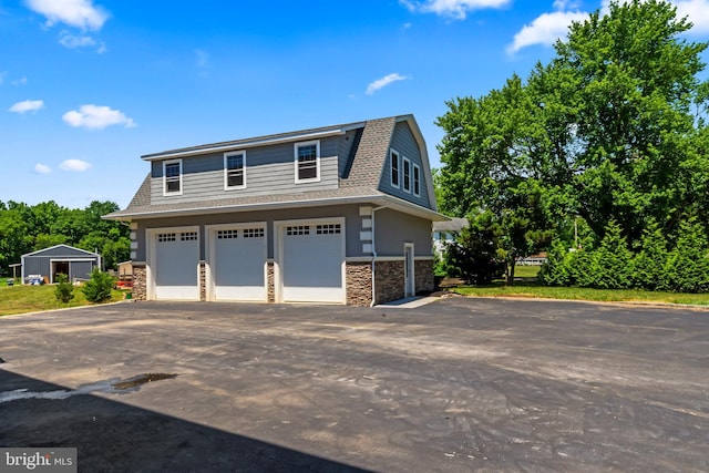 view of side of home featuring a garage