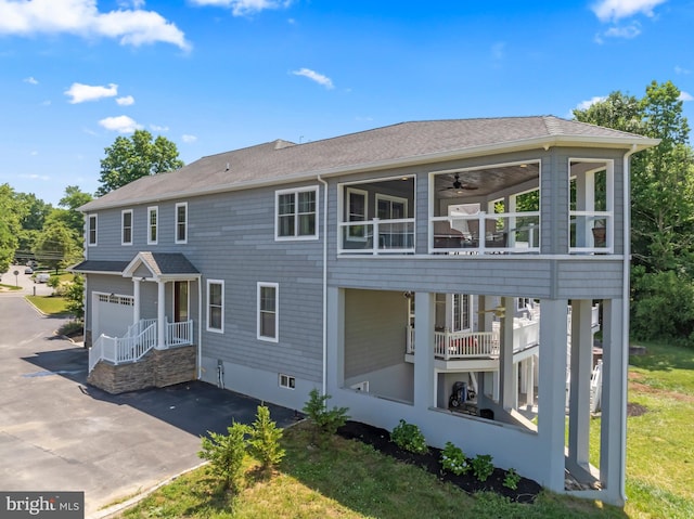 view of front facade with a balcony and a garage