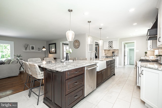 kitchen featuring white cabinetry, sink, stainless steel dishwasher, and white gas range oven