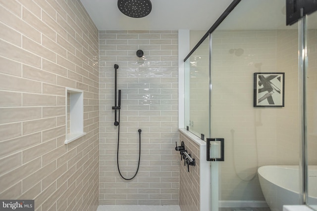 bathroom with separate shower and tub