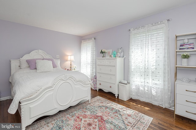 bedroom featuring dark hardwood / wood-style floors