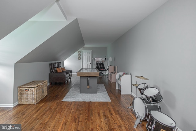 playroom with dark hardwood / wood-style floors and vaulted ceiling