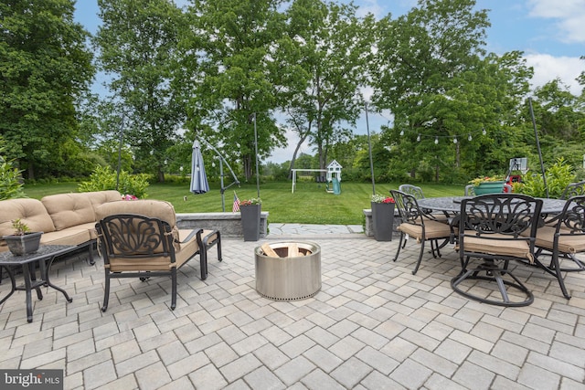 view of patio / terrace with an outdoor living space and a playground