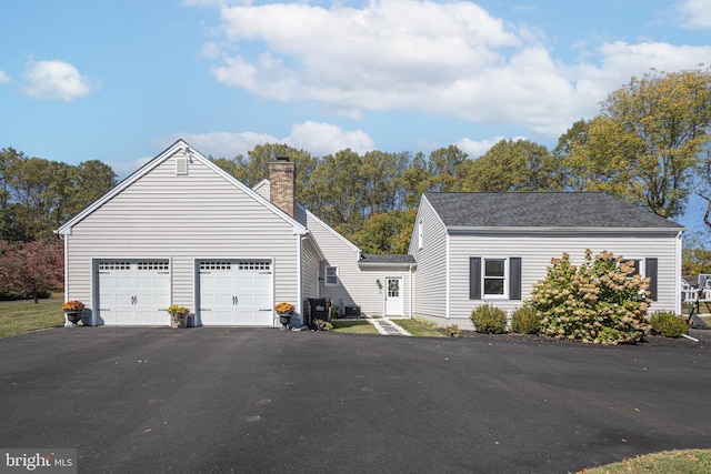 view of property exterior with a garage