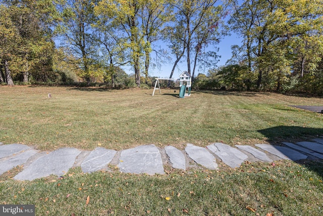 view of yard with a playground