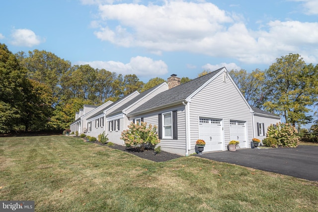 view of property exterior with a garage and a lawn