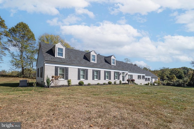 new england style home featuring a front yard and central AC