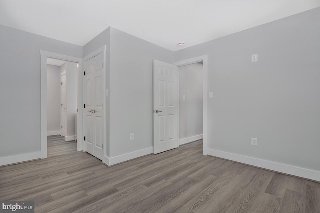 unfurnished bedroom featuring light wood-type flooring