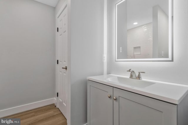 bathroom featuring vanity and wood-type flooring