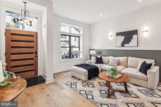 living room featuring hardwood / wood-style flooring, baseboards, and recessed lighting