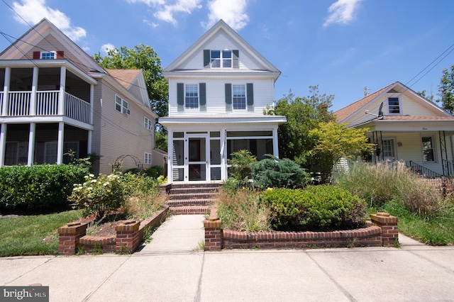 view of front of home featuring a sunroom