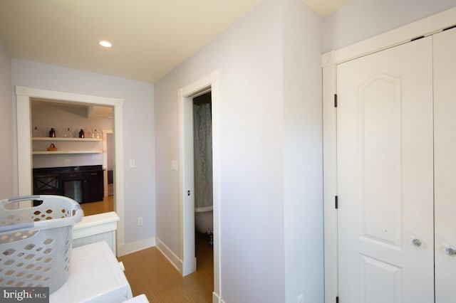 bathroom with hardwood / wood-style flooring